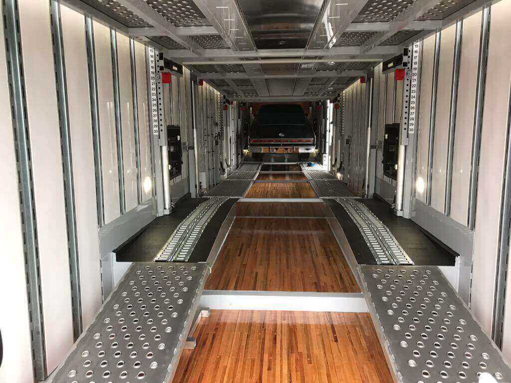 Car Shipping inside an enclosed auto transport car trailer that is very clean and new. Covered car services are available nationwide.