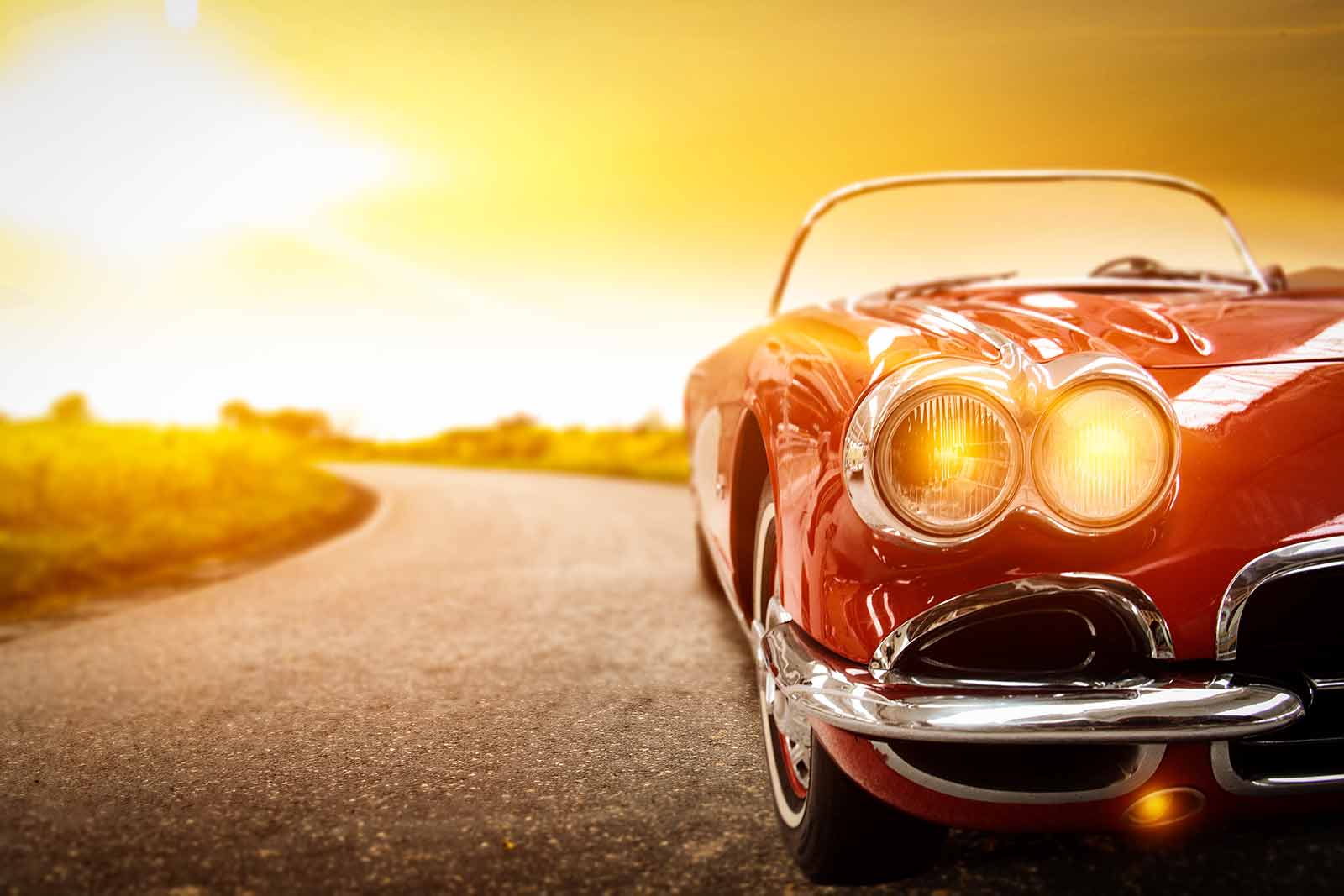 Classic red car before a sunset.