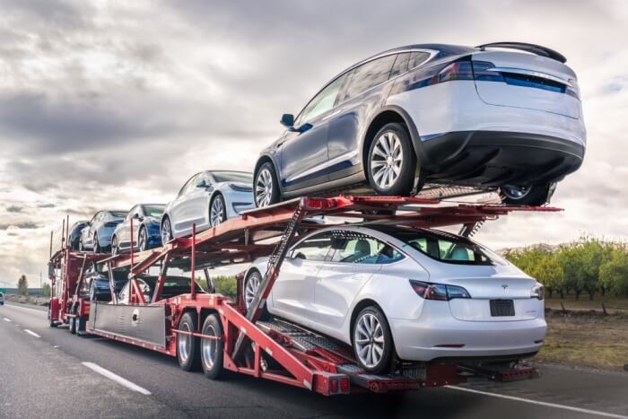 Cars being shipped on a carrier. All of the National Transport Services carriers will have car shipping insurance.
