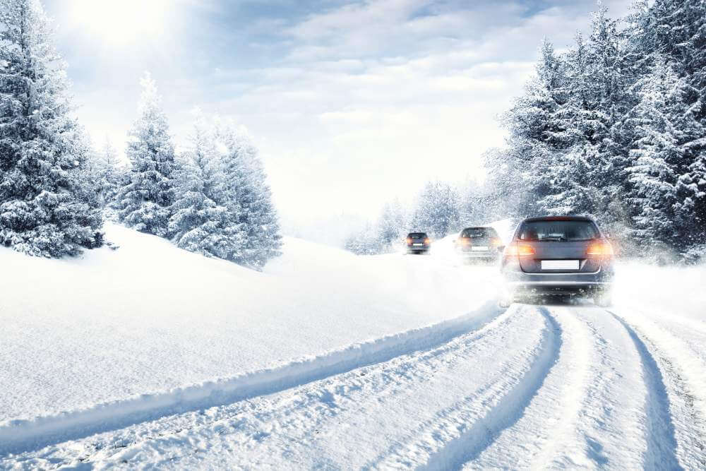 Cars on a snowy winter road.