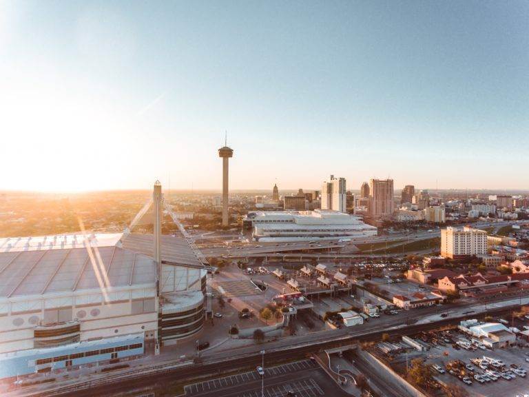 An aerial view of downtown San Antonio, TX. We are a family-owned auto transport company based in SATX. Get instant car shipping quotes from National Transport Services