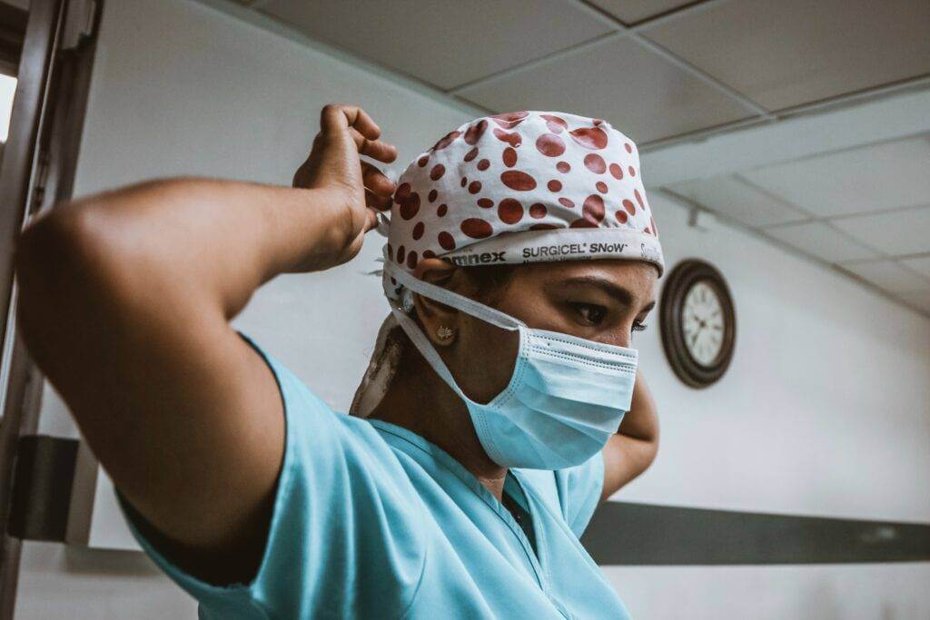 Nurse wearing a mask.