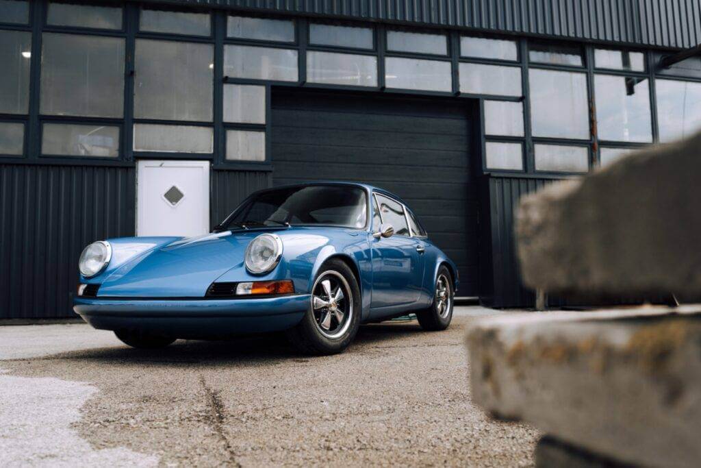 A 1960s Porsche 911 in Blue. Buying a classic car is a great way to safeguard your money.