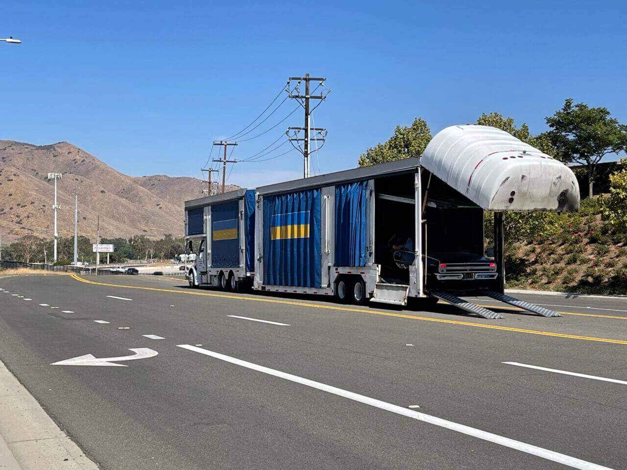 A soft side covered car transporter. Enclosed car transport is how we started. We initially started shipping classic cars for some of the largest collector car dealerships in the U.S.